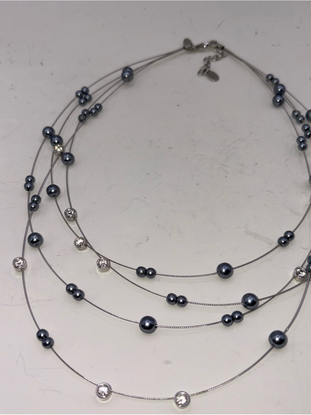 NOLAN MILLER Signed Clear Rhinestone & Grey Faux Pearl Silver Tone Necklace